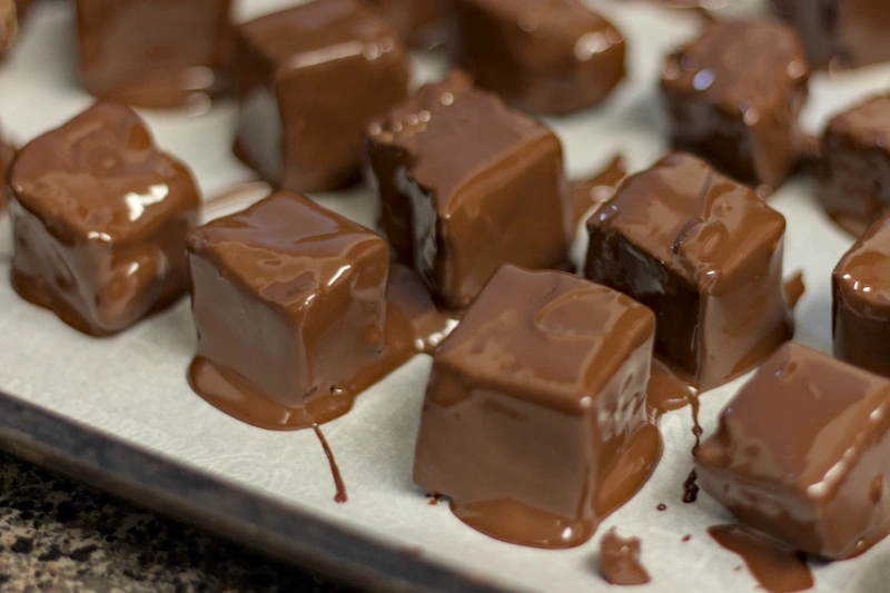 The halva cubes covered in melted chocolate